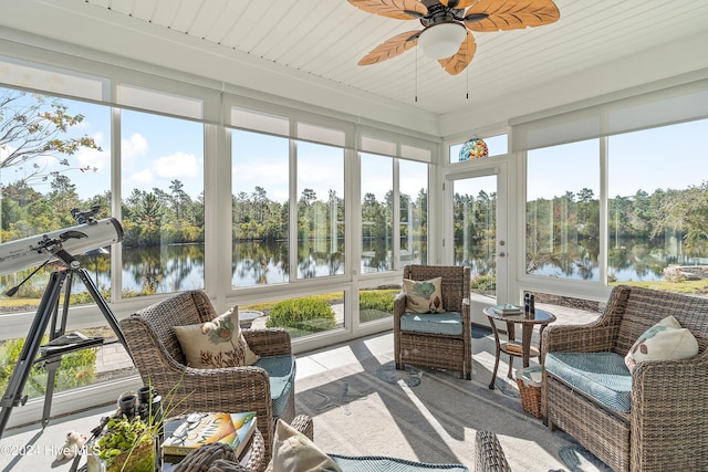 sunroom with a water view, ceiling fan, and wooden ceiling