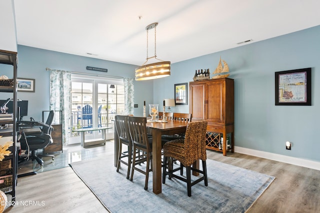 dining room with light wood-type flooring