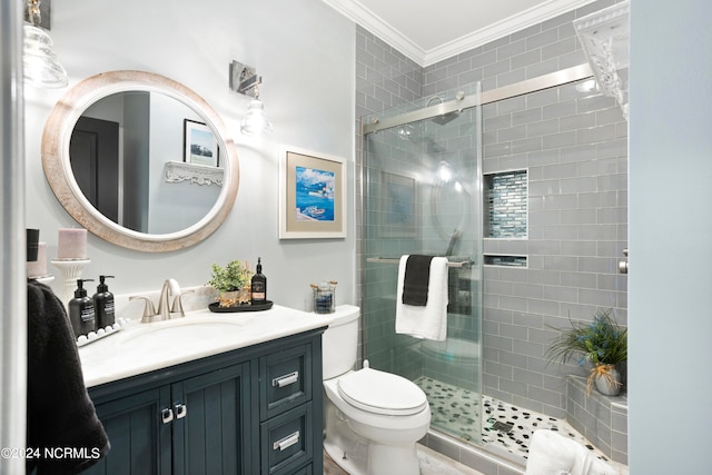 bathroom with toilet, crown molding, walk in shower, and vanity