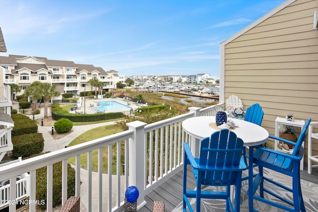 balcony featuring a water view