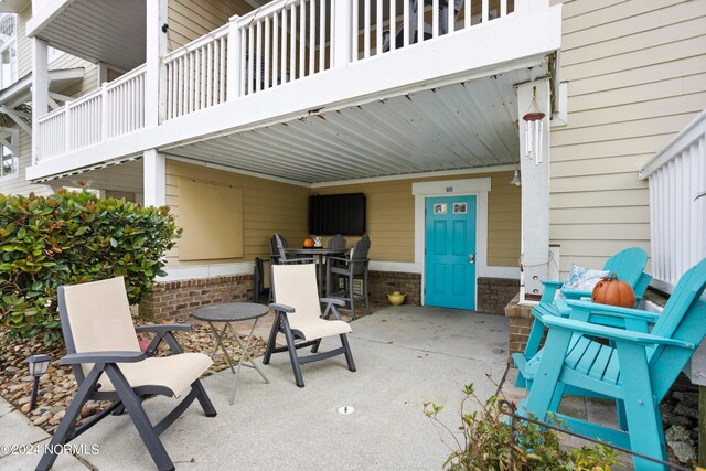 view of patio with a balcony