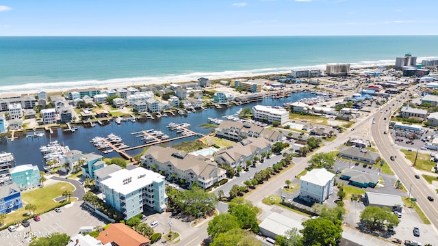 bird's eye view featuring a view of the beach and a water view