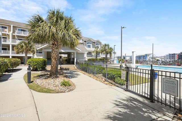 view of property's community with a pool