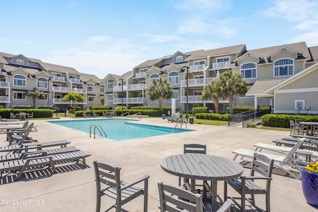 view of swimming pool with a patio area