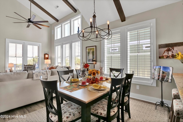 dining room featuring beamed ceiling, ceiling fan with notable chandelier, light wood-type flooring, and high vaulted ceiling