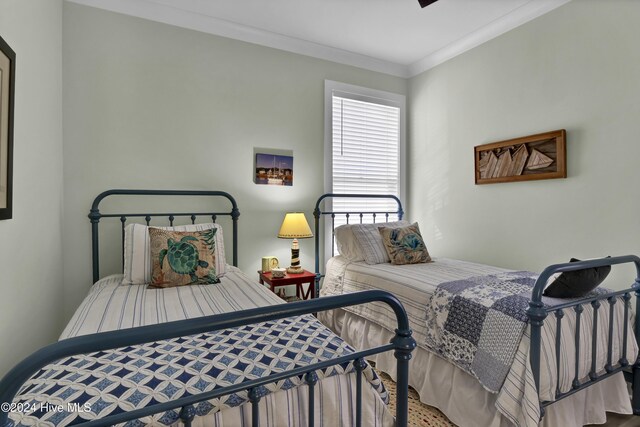 bedroom featuring crown molding