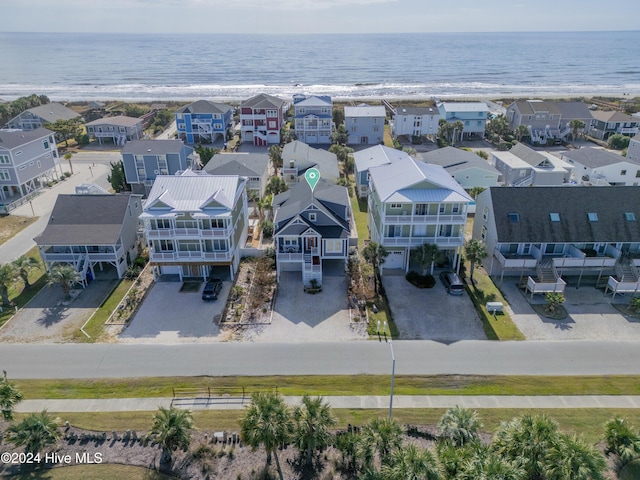 drone / aerial view featuring a water view and a residential view