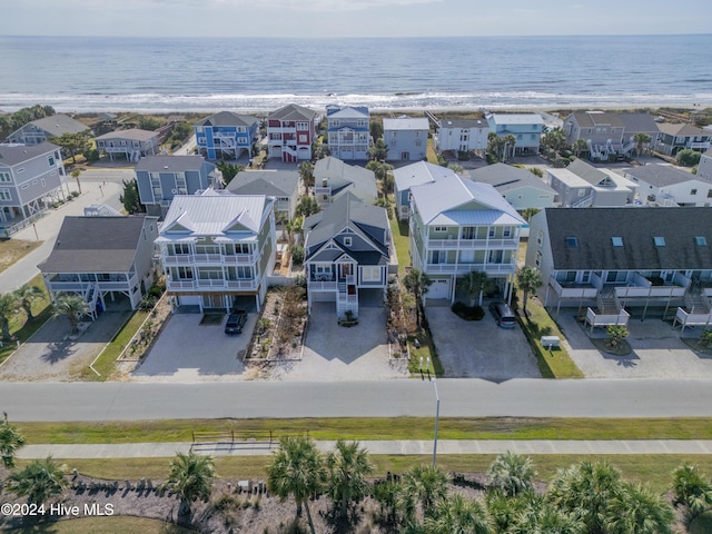 drone / aerial view with a water view and a residential view