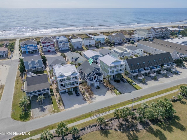 birds eye view of property with a water view, a residential view, and a view of the beach