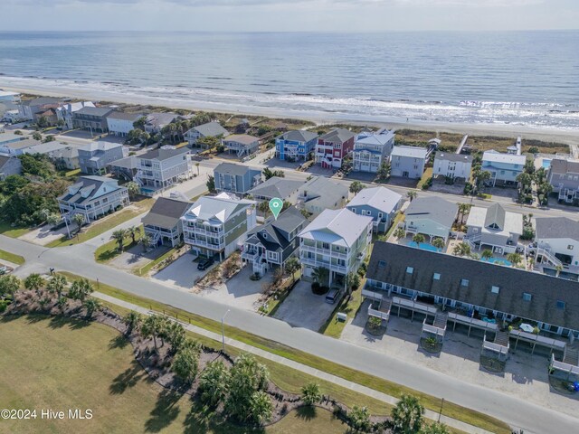 drone / aerial view with a water view and a view of the beach