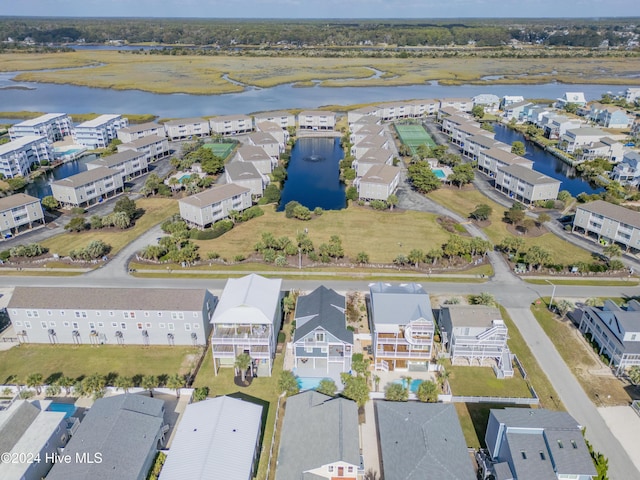 drone / aerial view featuring a water view and a residential view