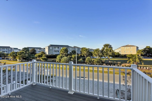 wooden terrace with a residential view