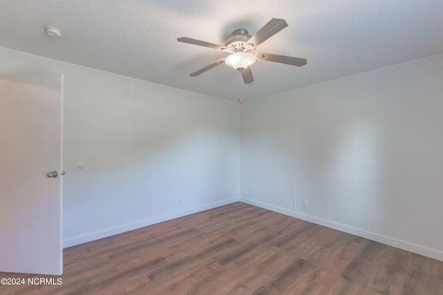 empty room featuring a textured ceiling, hardwood / wood-style flooring, and ceiling fan