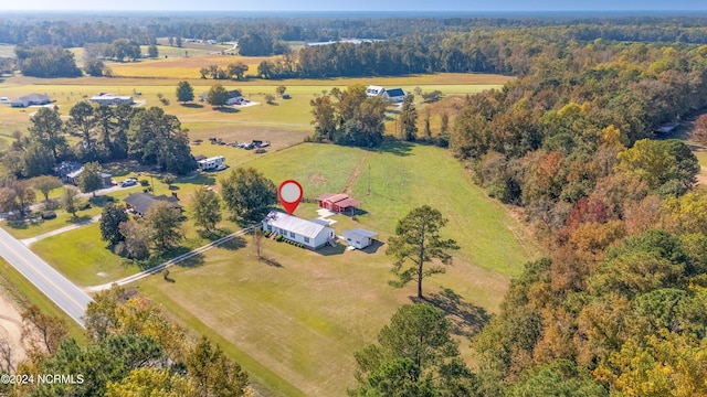 birds eye view of property featuring a rural view