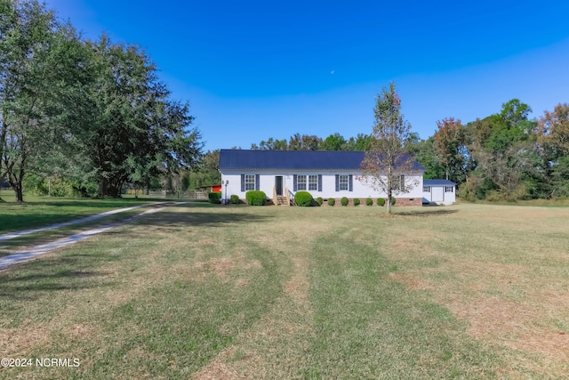 ranch-style home with a front yard