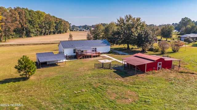 birds eye view of property with a rural view