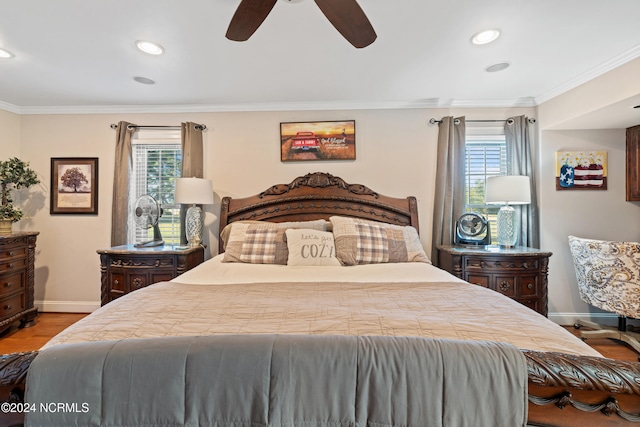 bedroom featuring ceiling fan, ornamental molding, and light hardwood / wood-style flooring