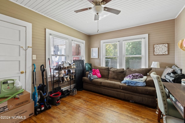 living room with hardwood / wood-style floors, ceiling fan, a healthy amount of sunlight, and wooden ceiling