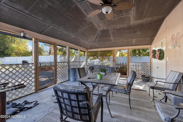 sunroom with a wealth of natural light, ceiling fan, and lofted ceiling