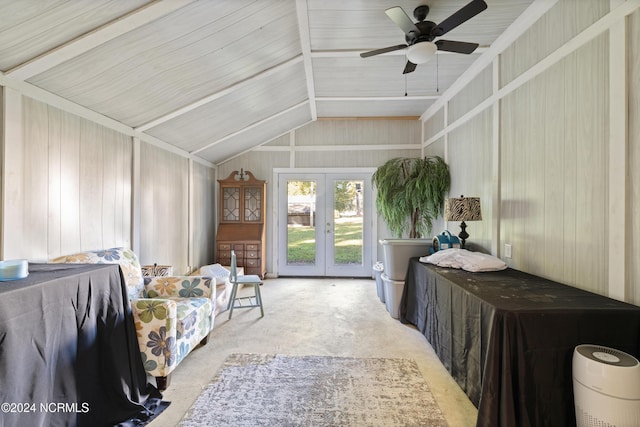 bedroom featuring lofted ceiling, access to outside, french doors, wooden walls, and ceiling fan