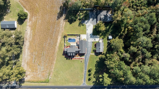 birds eye view of property with a rural view