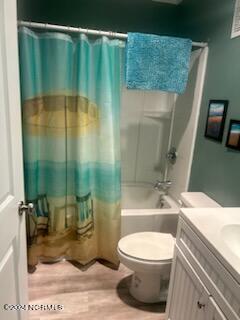 2196 New River Inlet Rd Unit 170, North Topsail Beach, NC 28460 - full bath featuring toilet, shower / bath combo, vanity, and wood finished floors
