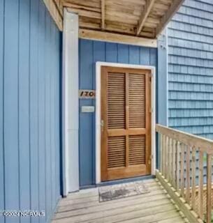 2196 New River Inlet Rd Unit 170, North Topsail Beach, NC 28460 - entrance to property featuring board and batten siding