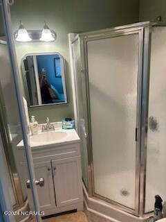 2196 New River Inlet Rd Unit 170, North Topsail Beach, NC 28460 - bathroom featuring vanity and a stall shower