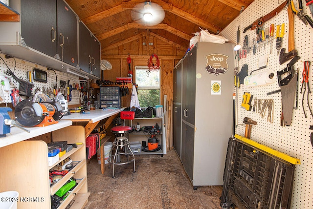 kitchen with wood ceiling, wooden walls, and vaulted ceiling