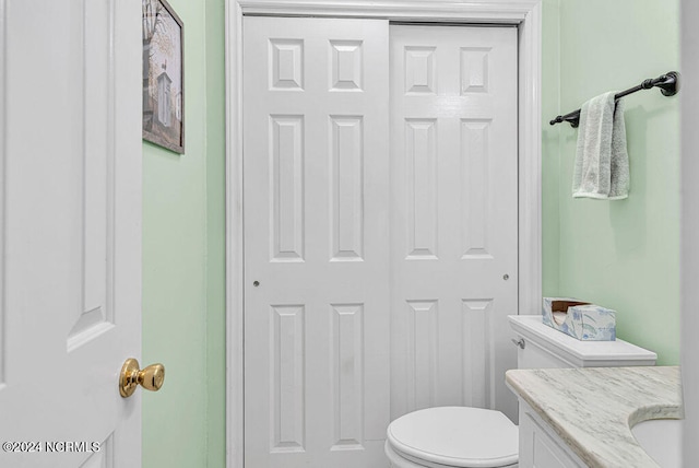 bathroom with toilet and vanity