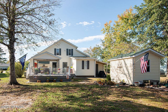 back of house featuring a yard and a wooden deck