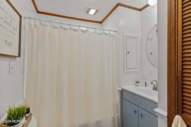 bathroom featuring vanity, ornamental molding, and a shower with curtain