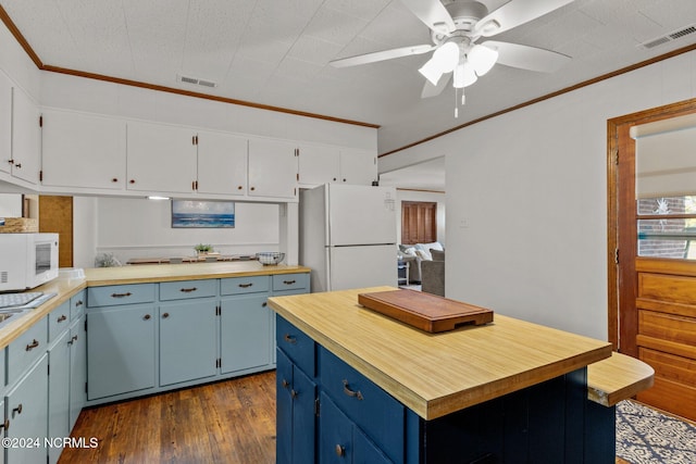 kitchen with white appliances, blue cabinets, ceiling fan, dark wood-type flooring, and ornamental molding