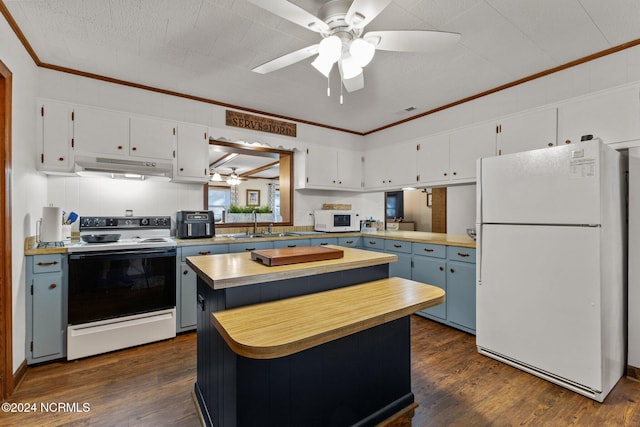 kitchen with white appliances, dark wood-type flooring, a kitchen island, and white cabinets