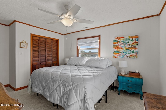 bedroom with ornamental molding, light colored carpet, a closet, and ceiling fan