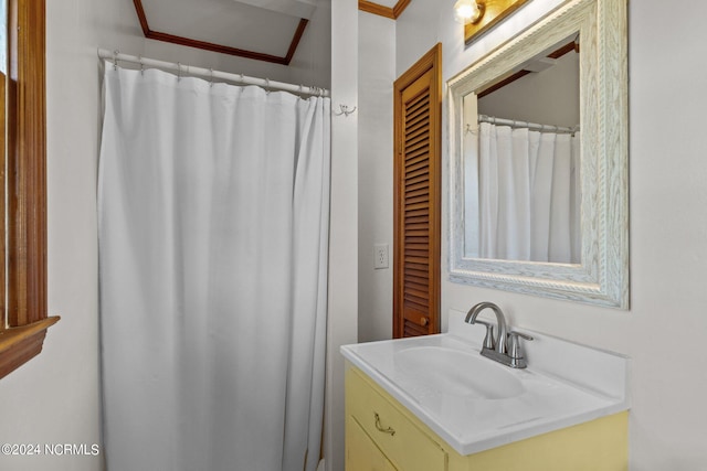 bathroom with vanity and crown molding