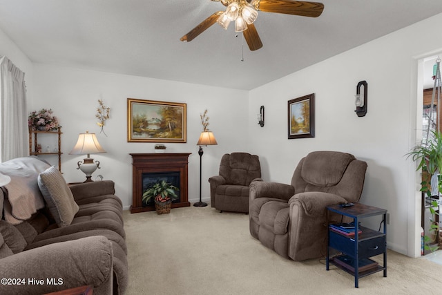 living room with ceiling fan and light colored carpet