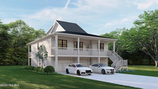 view of front of home featuring a garage, a front yard, and a porch