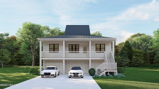 rear view of house featuring a garage, a yard, and a porch