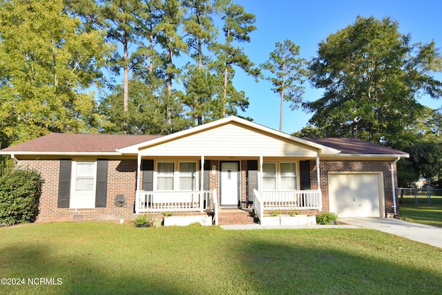 ranch-style house with a garage, a front lawn, and a porch