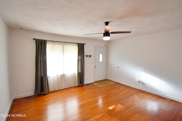 unfurnished room with light hardwood / wood-style floors and ceiling fan