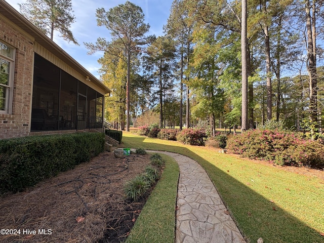 view of yard featuring a sunroom