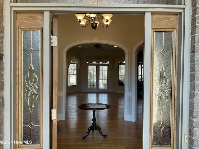 entrance foyer with french doors and a chandelier