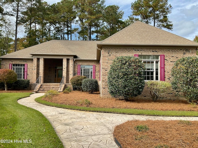 view of front of house with a front lawn