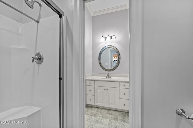bathroom featuring vanity, a shower, and ornamental molding