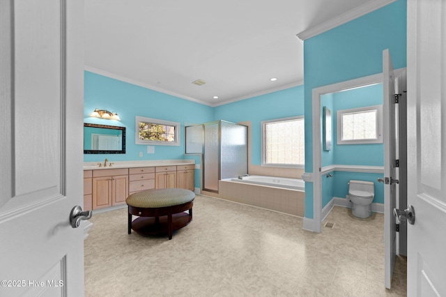 bathroom featuring a bath, crown molding, vanity, and toilet