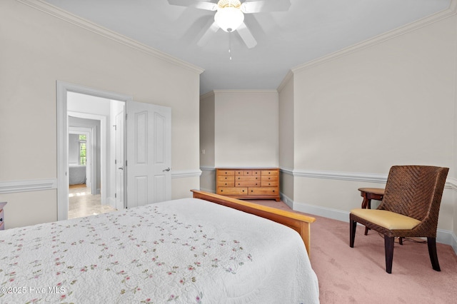 bedroom featuring ceiling fan, baseboards, crown molding, and carpet