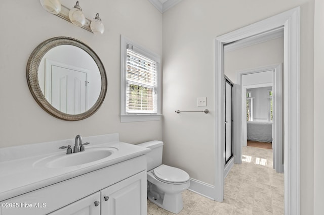 bathroom with a shower with shower door, toilet, baseboards, tile patterned flooring, and vanity