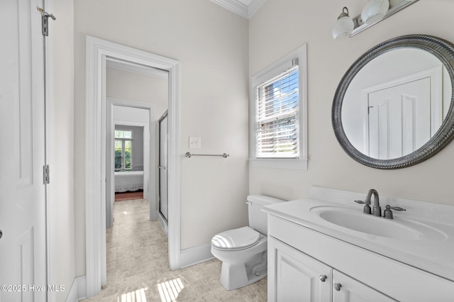 bathroom featuring tile patterned floors, toilet, vanity, ornamental molding, and baseboards