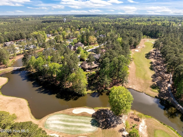 aerial view featuring a water view, golf course view, and a wooded view